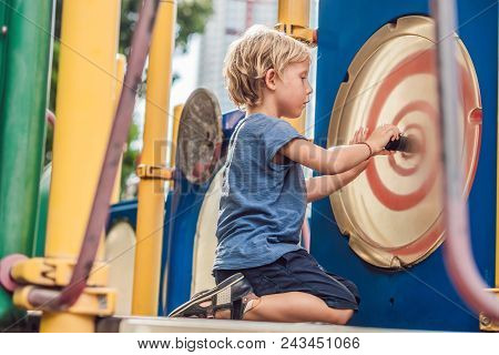 Funny Cute Happy Baby Playing On The Playground. The Emotion Of Happiness, Fun, Joy.