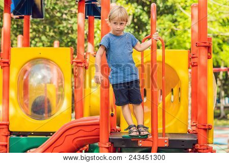 Funny Cute Happy Baby Playing On The Playground. The Emotion Of Happiness, Fun, Joy.