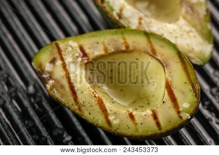 Sliced Fresh Avocado On The Grill. Health Food. Barbeque Avocado