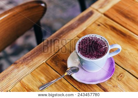 Lavender Latte In A Light Purple Cup On A Wooden Table. Lavender Latte Contains Lavender Flower Tinc