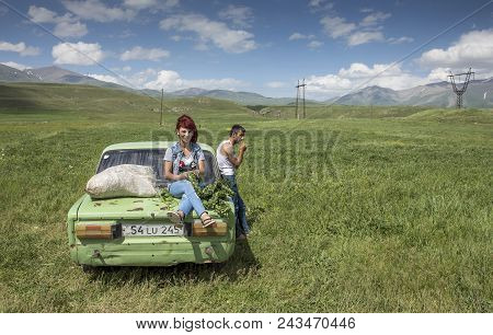 Areni, Armenia, 1st June, 2018: Family With Their Car On The Raodside, Collecting Herbs For Winter