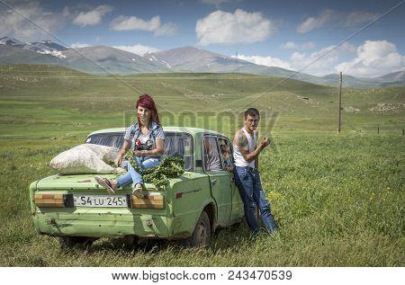 Areni, Armenia, 1st June, 2018: Family With Their Car On The Raodside, Collecting Herbs For Winter