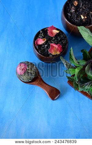 Different Sorts Of Tea And Mint Against The Blue Background