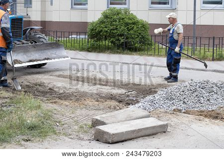 Road Works, Closing Holes In Asphalt And Workers June 2, 2018, Russia, Leningrad Region City Of Kiro