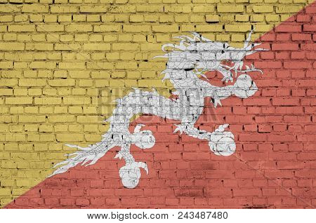 Bhutan Flag Is Painted Onto An Old Brick Wall