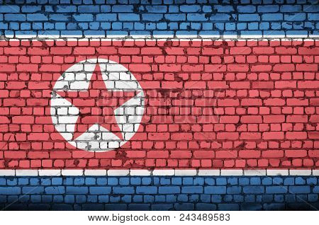 North Korea Flag Is Painted Onto An Old Brick Wall
