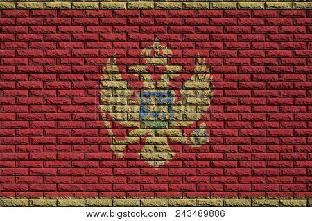 Montenegro Flag Is Painted Onto An Old Brick Wall