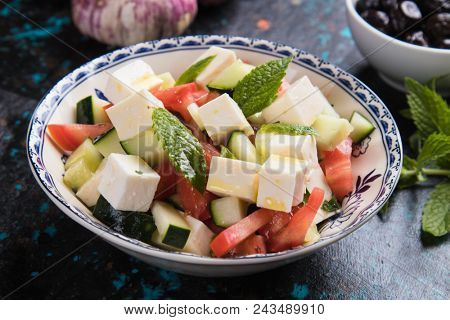 Greek salad with feta cheese cubes and fresk vegetables