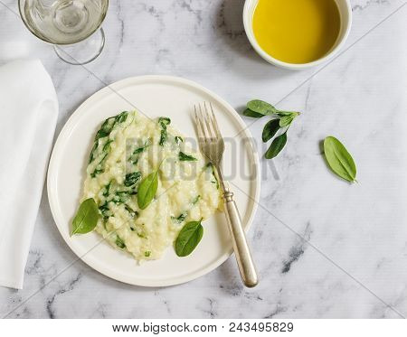 Gentle Cream Risotto With Spinach, Served With Wine. Light Background, Selective Focus.