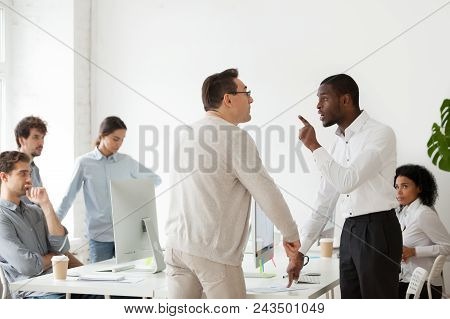 Angry African American Worker Arguing With Caucasian Middle Aged Mentor, Having Disagreement Over Wo
