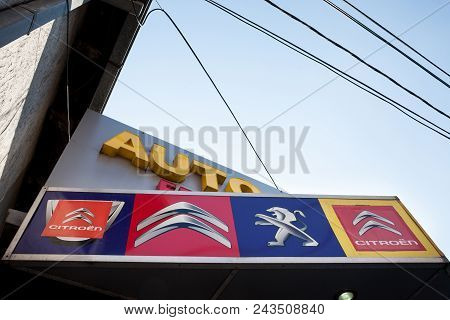 Belgrade. Serbia - May 27, 2018: Peugeot And Citroen Logo On An Sign Of A Car Dealership Of The Bran