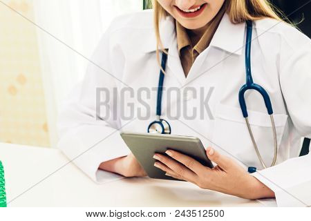 Female Doctor And Stethoscope Working With Tablat Computer In Hospital.healthcare And Medicine