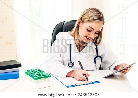 Female Doctor And Stethoscope Working With Tablat Computer In Hospital.healthcare And Medicine