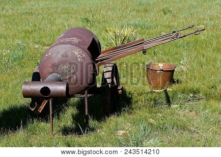 Metal Handled Irons Are Heating Up In A Homemade Barrel Shaped Oven At Roundup And Branding Session 