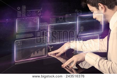 Male hands touching interactive table with purple cloudspace graphic on it 