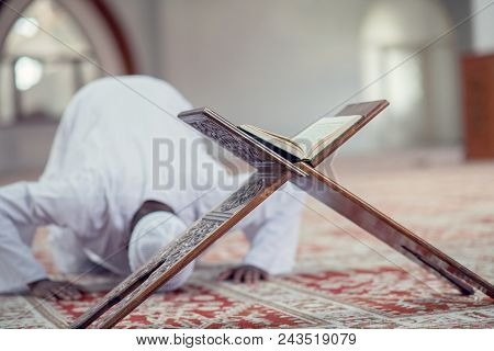African Muslim Man Making Traditional Prayer To God While Wearing Dishdasha.