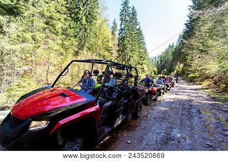 A Tour Group Travels On Atvs And Utvs On The Mountains.