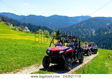 A Tour Group Travels On Atvs And Utvs On The Mountains.