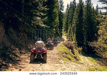 A Tour Group Travels On Atvs And Utvs On The Mountains.