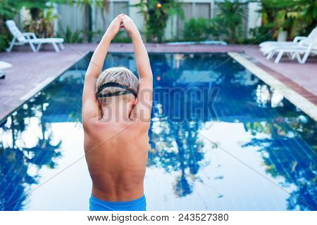 Child Ready To Jump In Swimming Pool Blue Water