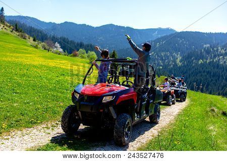 A Tour Group Travels On Atvs And Utvs On The Mountains.