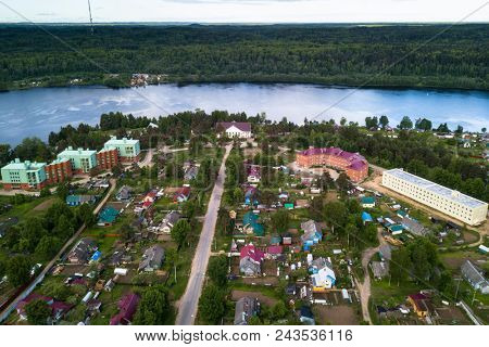 Aerial view of the Svir river and houses in urban-type settlement, Nikolskiy, Leningrad region, Russia.