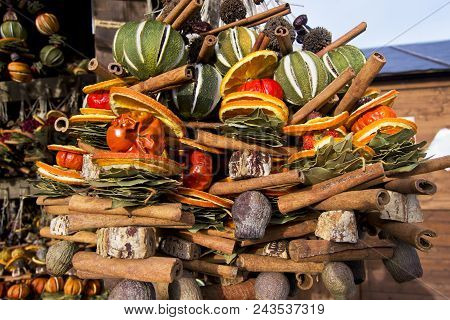 Colorful Xmas Decoretions With Dry Fruits To Hang With Oranges, Lemons And Cinnamoms