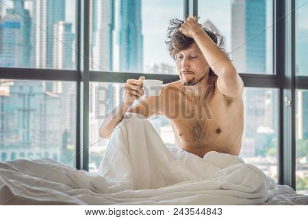 Man Wakes Up In The Morning In An Apartment In The Downtown Area With A View Of The Skyscrapers And 