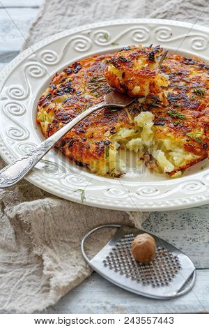 Swiss Potatoes Rosti On A White Plate.