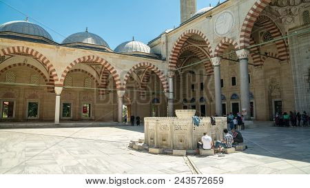 A View From The Inner Court Of Selimiye Mosque In Edirne. People Are Performing Ablution Before Pray