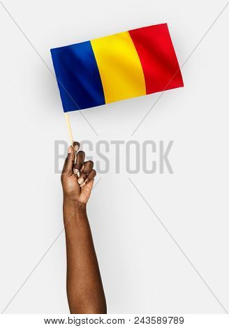Person waving the flag of Romania