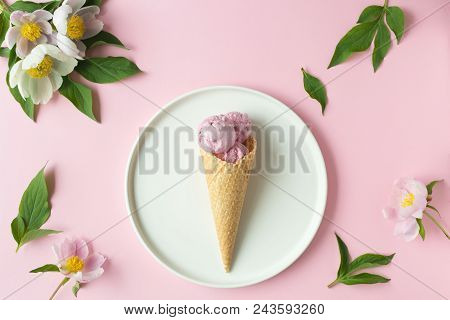 Spring Or Summer Mood Concept. Flat-lay Of Waffle Sweet Cone With Berryy Over Pastel Light Pink Back