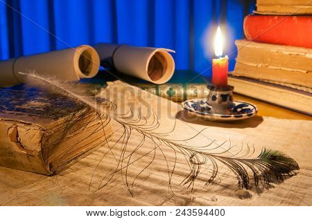 Green Quil Pen And Black Inkwell With Old Papers And Books