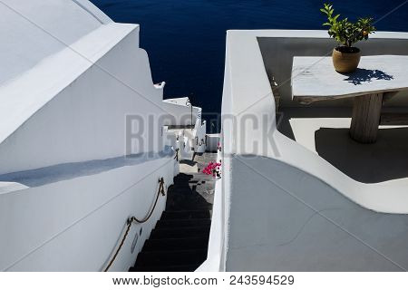 Typical Mediterranean Urban City And Sea Landscape Seen From A Terrace. Santorini Greece