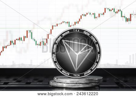 Tron (trx) Cryptocurrency; Tron Coin On The Background Of The Chart