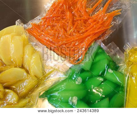 Carrots Apples Pears And Other Cooked Vegetables Are Vacuum Packaged In Containers