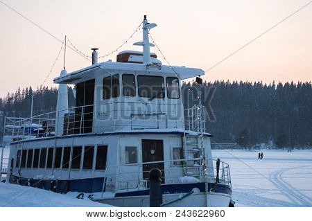 A Boat On A Frozen Lake Waiting For The Summer To Get Back To The Business.