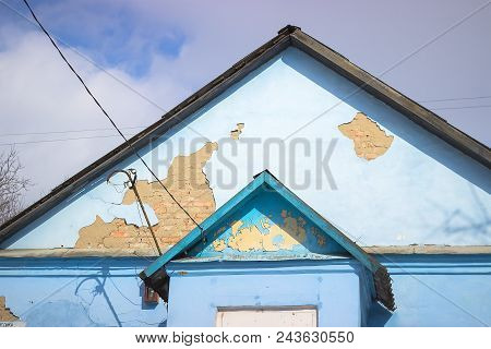 Detail Of An Abandoned Building In Cloudy Sky Landscape