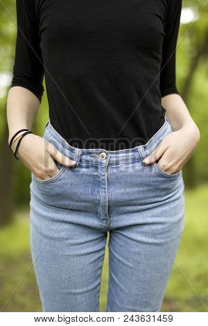 Closeup At Womens Hips In Denim At Outdoors