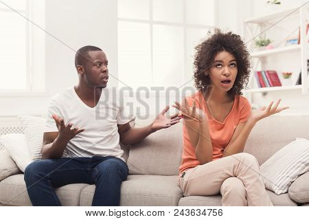 Young African-american Couple Quarreling At Home, Woman Offended. Family Relationship Difficulties C