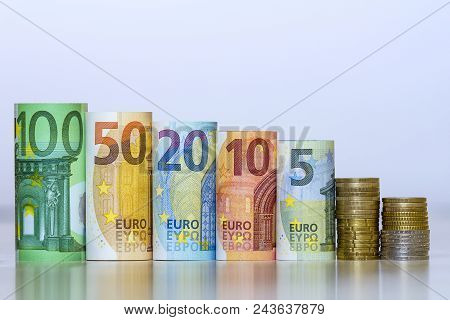 Straight Row Of Accurately Rolled Hundred, Fifty, Twenty, Ten And Five New Paper Euro Banknotes And 