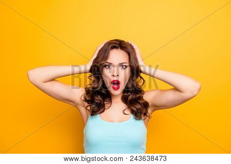 Wtf! Portrait Of Irritated Impressed Woman Holding Two Hands On Head Keeping Wide Open Mouth Looking