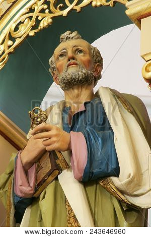 SISAK, CROATIA - DECEMBER 07: Statue of Saint Peter on the main altar in the Church of Holy Cross in Sisak, Croatia, on December 07, 2017.