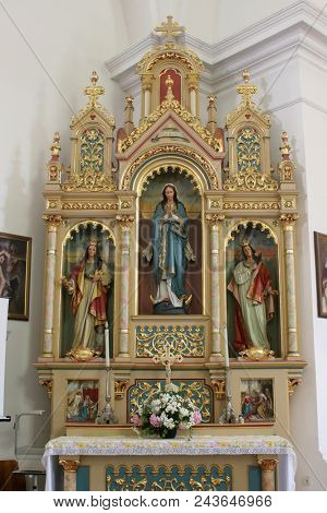 SISAK, CROATIA - DECEMBER 07: Altar of Our Lady in the Church of Holy Cross in Sisak, Croatia, on December 07, 2017.