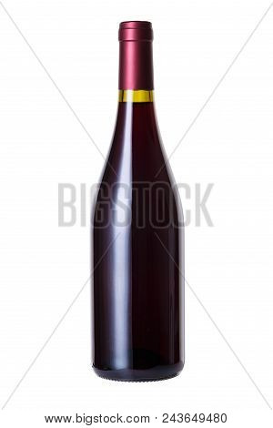 Pouring White Wine Into The Glass Against Wooden Background