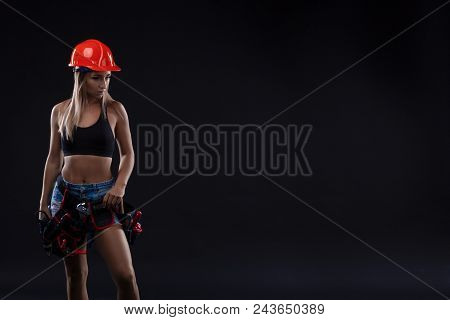 Beautiful Blond Woman With Heavy Perforator In Her Hands. Portrait Of A Female Construction Worker. 