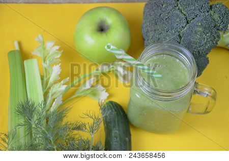 Detox Healthy Green Smoothie In Mason Jar With Ingredients: Spinach, Celery, Cucumber, Lettuce, Ging