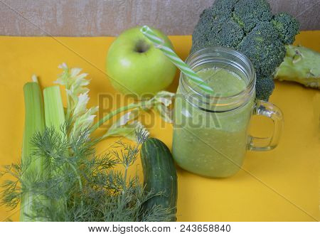 Detox Healthy Green Smoothie In Mason Jar With Ingredients: Spinach, Celery, Cucumber, Lettuce, Ging