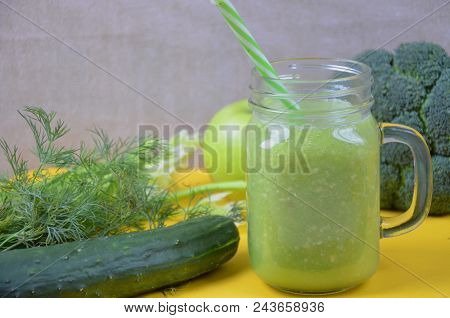 Detox Healthy Green Smoothie In Mason Jar With Ingredients: Spinach, Celery, Cucumber, Lettuce, Ging