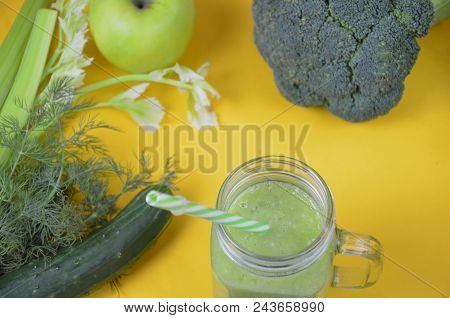 Detox Healthy Green Smoothie In Mason Jar With Ingredients: Spinach, Celery, Cucumber, Lettuce, Ging